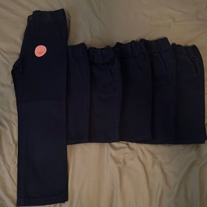 6 pairs of boys navy blue uniform stretch pull on chino pants.